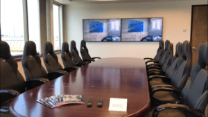 two tv mounted on wall